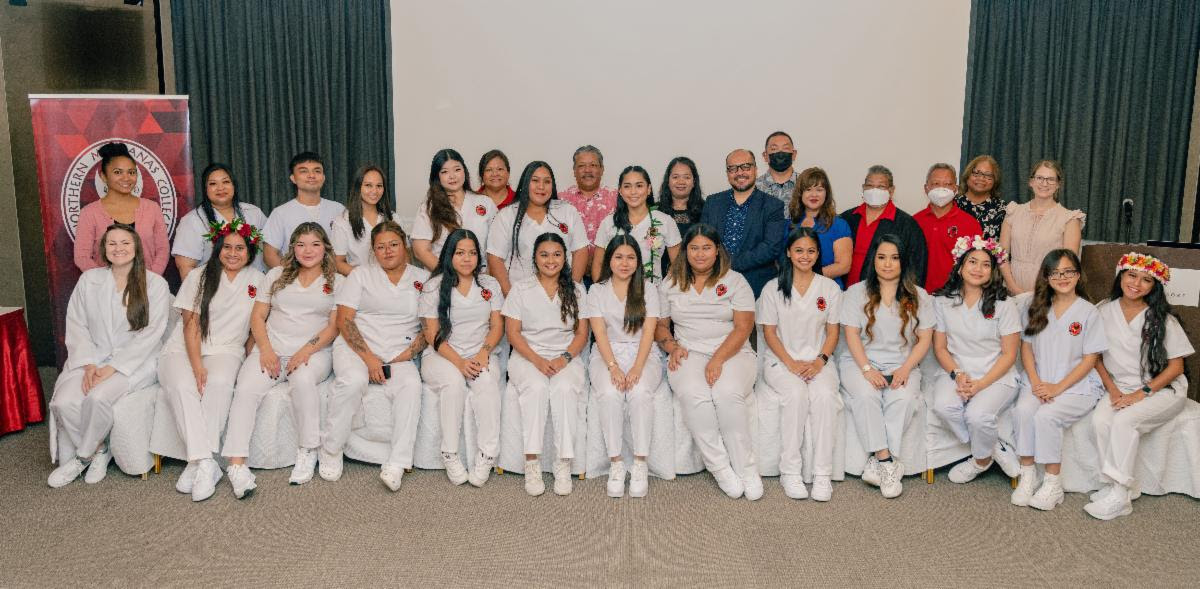 Nineteen Northern Marianas College students received their Certificates of Completion in Nursing Assistant after participating in a 10-week training conducted by NMC in collaboration with the Area Health Education Center. In the photo with the students is NMC President Galvin Deleon Guerrero, EdD, NMC Regent Jesse Tudela, NMC Dean of Student Support Services Charlotte Cepeda, NMC Interim Dean for Academic Programs and Services Vilma Reyes, NMC nursing faculty members Johnny Aldan and Breanna Lee, NMC Nursing Department Chair Rosa Aldan, NMC Tinian Executive Director Maria Aguon, Program Manager for CNMI Area Health Education Center Les Ogumoro-Uludong, Tinian Mayor Edwin P. Aldan, and Commonwealth Healthcare Corporation Chief Executive Officer Esther Muna.